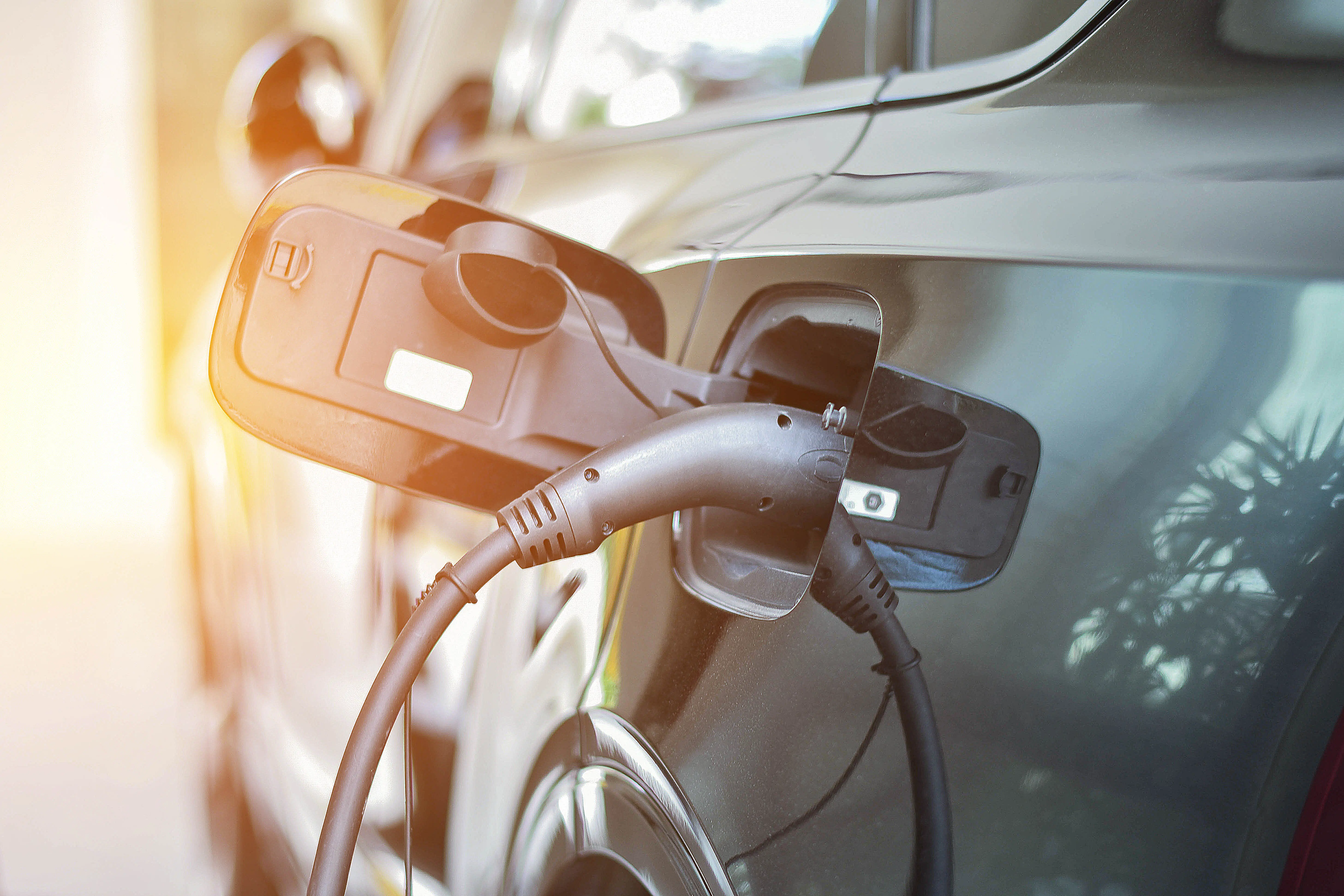 Electric Car Charging Orange Sunlight With Clean Energy Vehicle Concept Global Warming Car